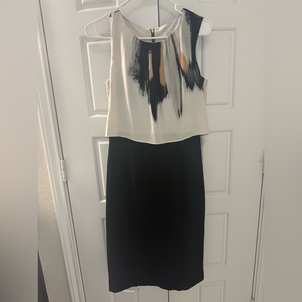 New York and company black sleeveless dress with flowy top, attached